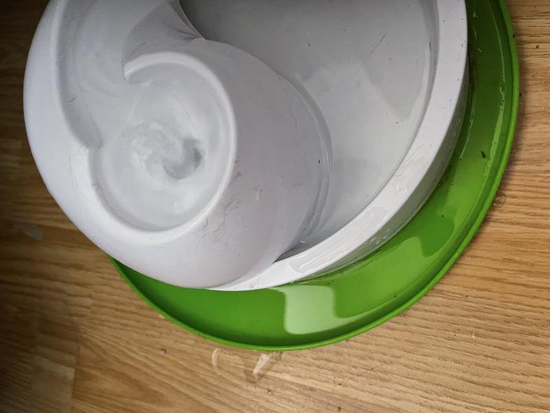 Shows leakage caused by the fountain top as water exits the unit.