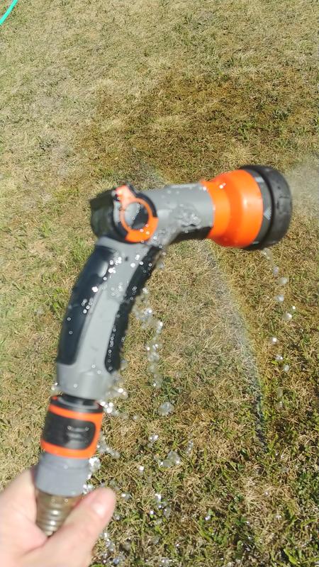 Water gushing from between the grey and black plastic