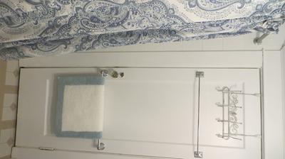 Towel rack attached to the door