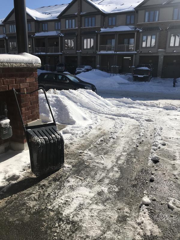 Look at the tracks on the left, you just slide it on top of mount and then turn it on either side to dump the snow.