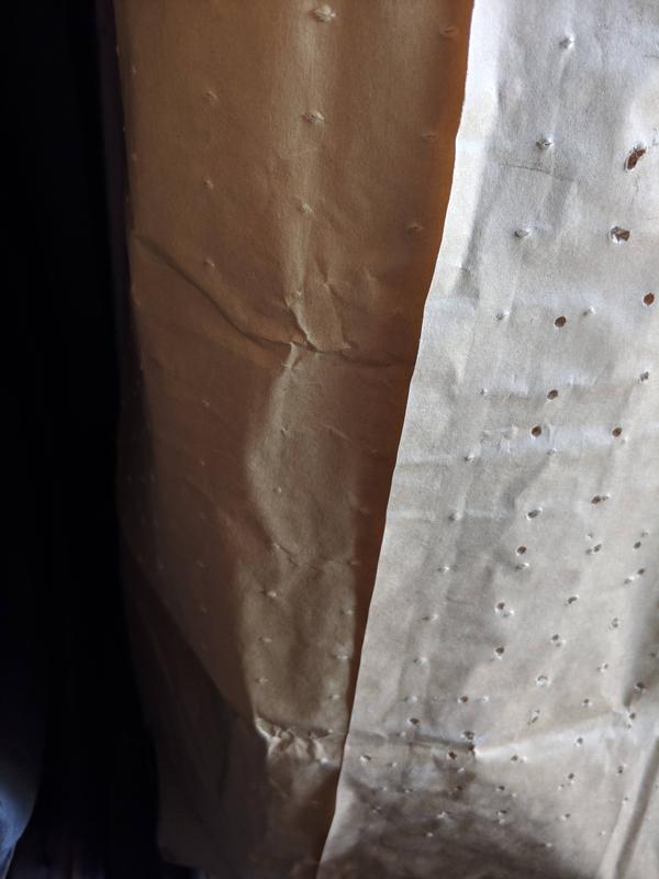 Original holes left (not really because the punch didn't go through all the way) and my holes on the right.