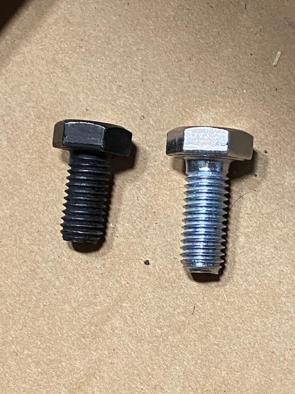 M10 x 1.5 bolts. Left is stock and right is 25mm or approx 1”