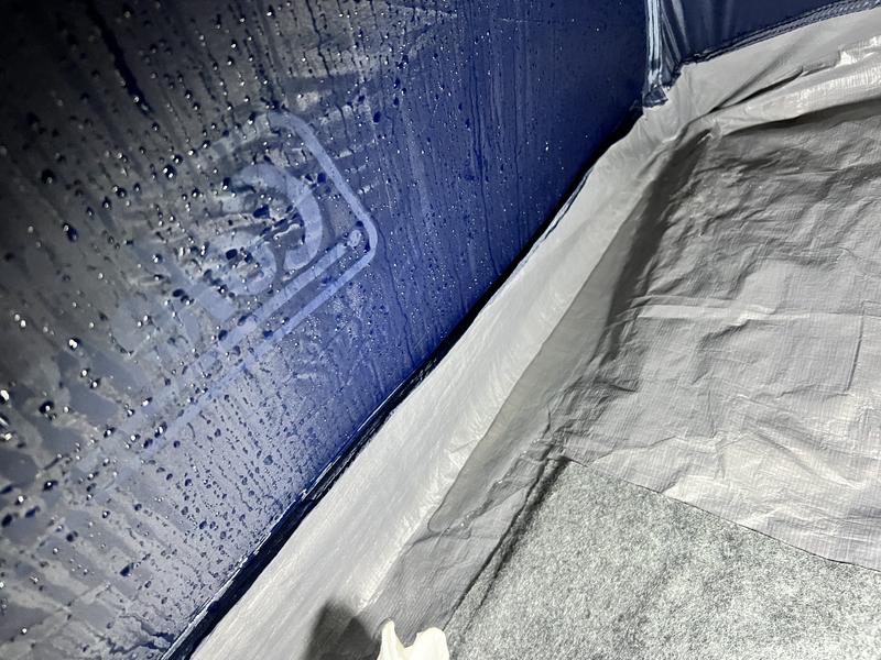 Soaked wall and large puddle.