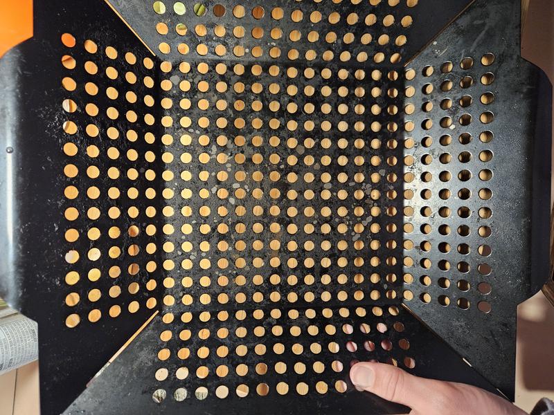 After use and after washing,  you can see residual food that stuck on (and therefore burned) and the silver is portions of the nonstick coating coming off.