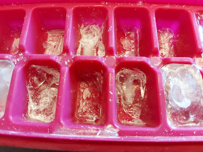 Ice cube fragments stuck in tray