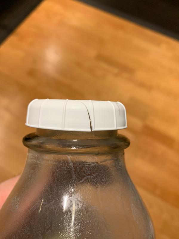 Flimsy bottle cap that has ripped after a few days