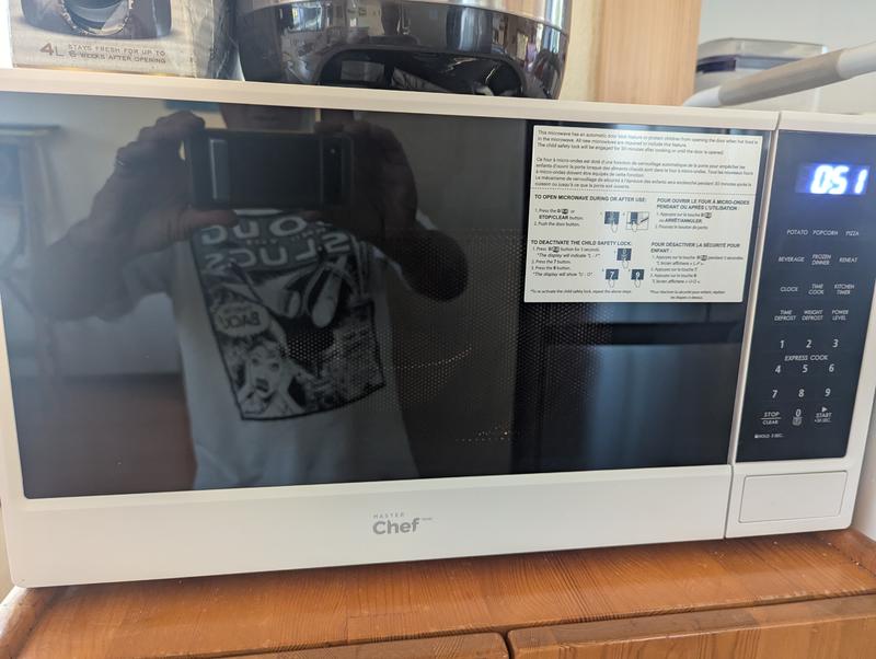 Oven is ON, but the bowl inside is almost invisible.