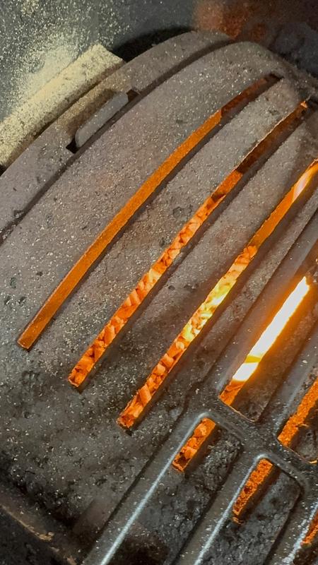 Excess pellets in burn hopper.  Dangerously full.