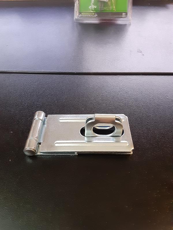 Another angle.  You'll see that in order for the locking loop to fit into the slot, the base of the loop overlaps the base of the hasp - preventing proper installation on your (i.e. door or cabinet, etc...)