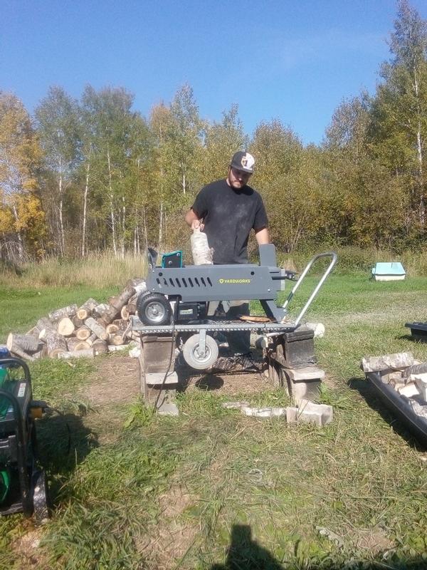My son Travis splitting wood