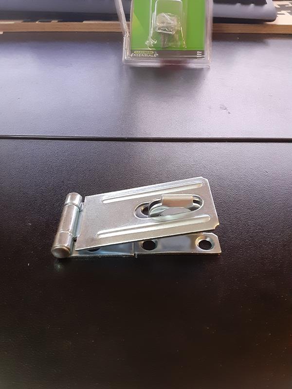 Notice, that when the locking portion and the hasp align (the part touching the table), the slot doesn't align with the locking portion, prohibiting the hasp to close properly