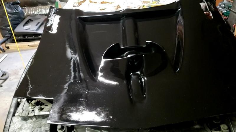 Underside of hood after 3 coats paint, 2 costs clear, wet sand, compound, and polish.