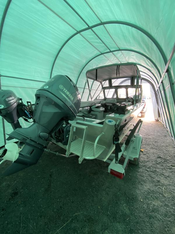 Lots of room on each side of the boat, behind and in front, even with the trailer tongue inside (I don't have a folding trailer tongue either)