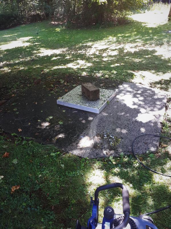 Pressure wash cement pad