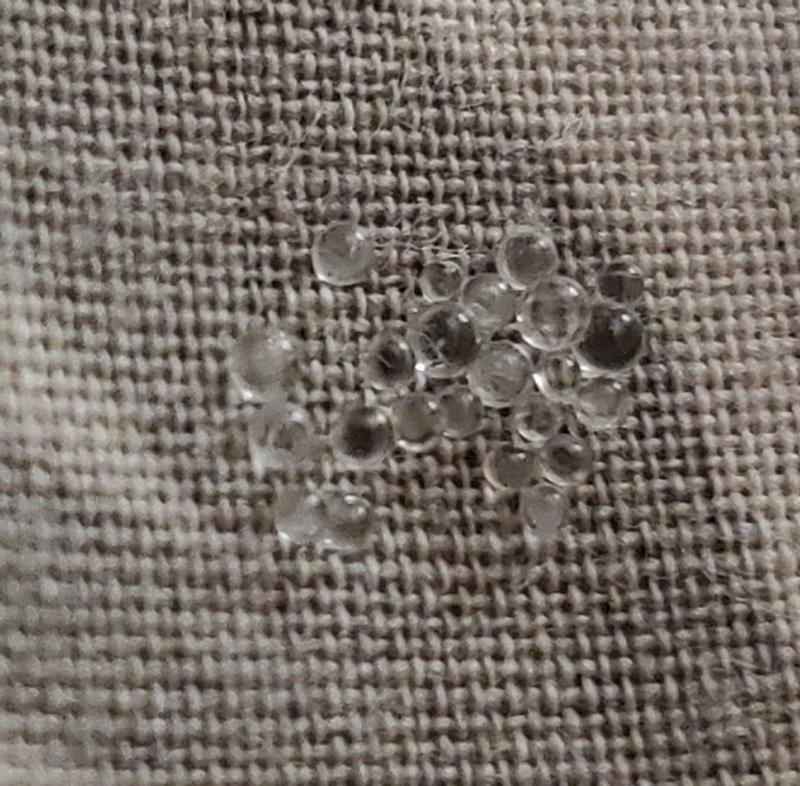 SUPER tiny glass beads coming out after a year of nightly use.