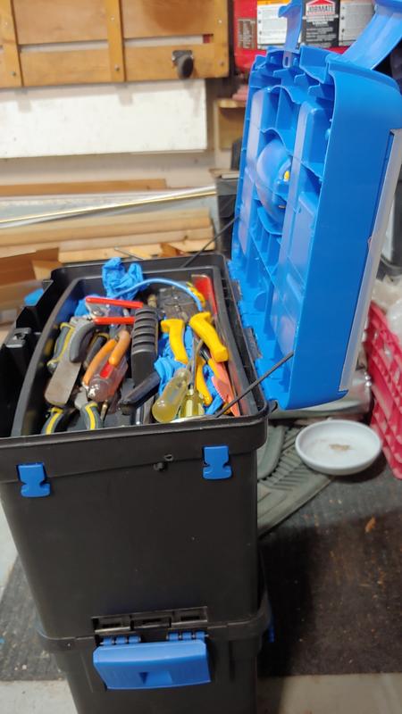 Knot the cord so that the lid is supported just past the vertical, to reduce strain on the hinge and prevent the whole box from falling backwards, if not sufficiently loaded at the bottom.