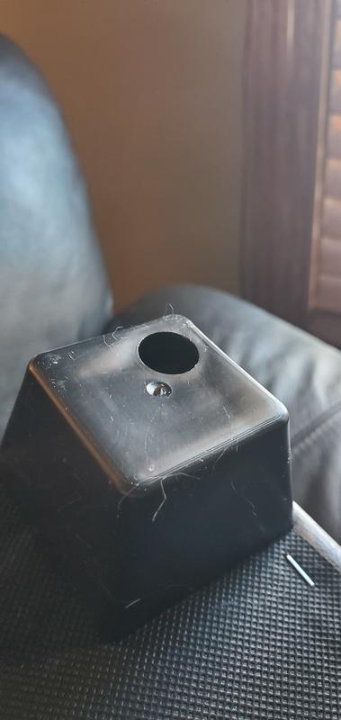 The sharp point is beside the hole.