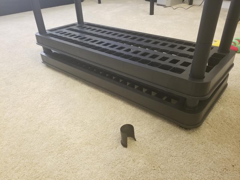 Shelf slid down to the ground. Flimsy cuff in front of the shelf.