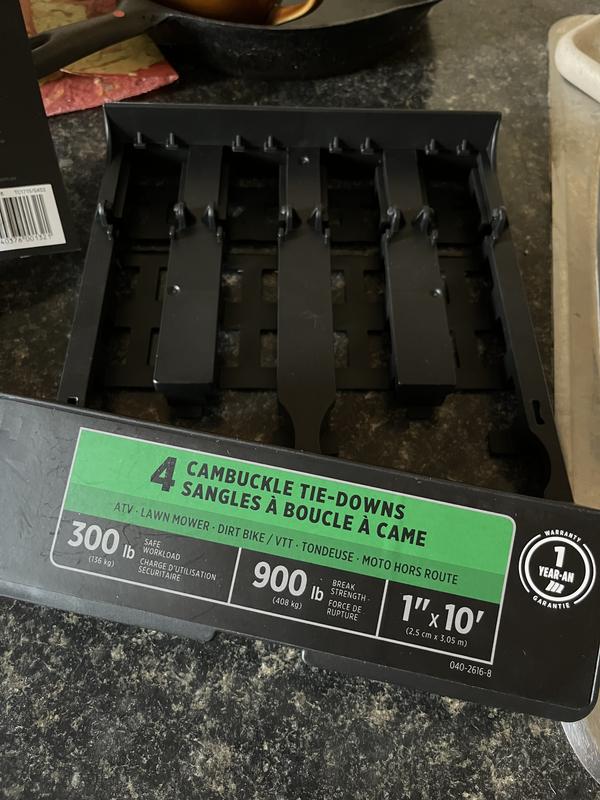 The box I had to pry off to get the tie-downs out, using a screw driver to release the tabs that hold it on.