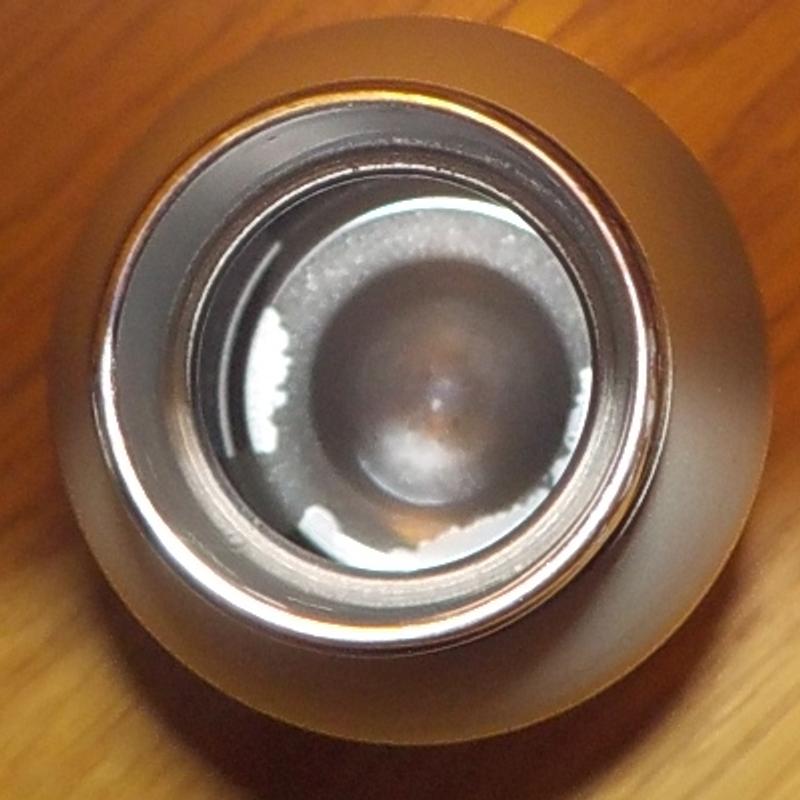 Bottle as seen from above.  Coating on bottom is coming off.   Bottle is only a few weeks old.