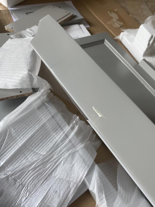 Paint on the side of the top of the cabinet  not a scratch but a smudge in the paint job before the clear coat