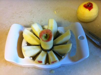 peeled apples being cored