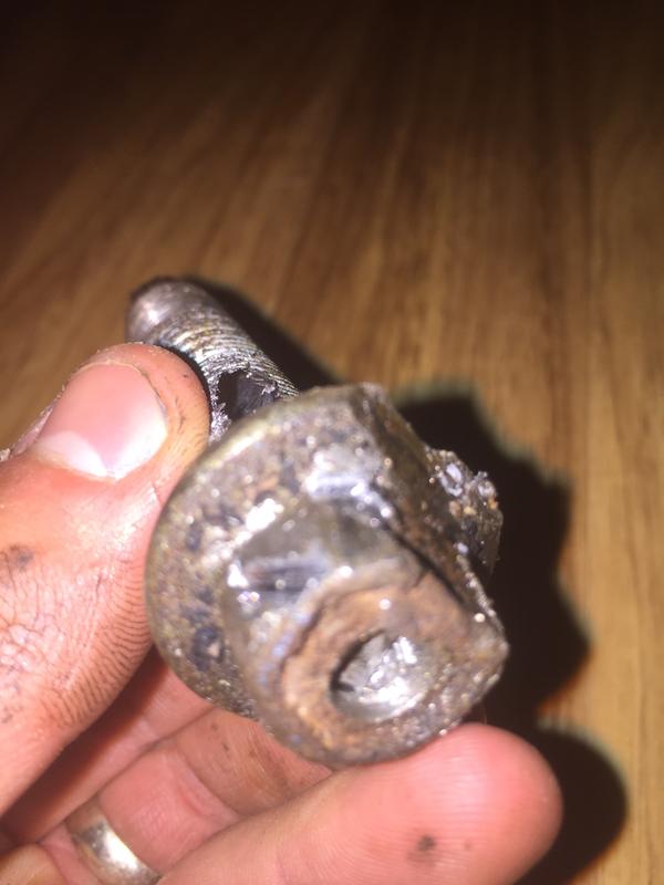 Broken extractor in the middle. Bolt extractor socket bit into head and I removed the bolt