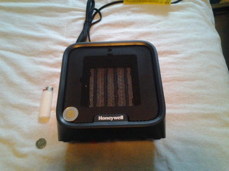 Toonie Size on grill. Lighter and Quarter, resting on same height as back of device.
