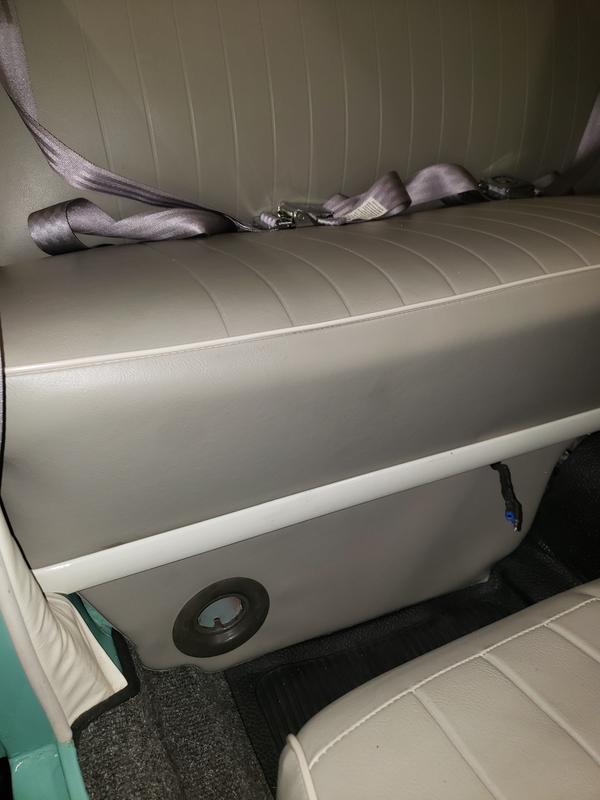 Seat fits over the larger battery and modified strap/cover, fully seated into the support channel without interference