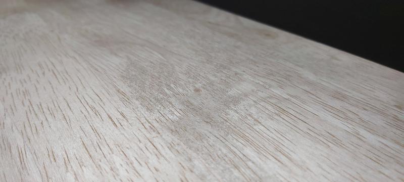 Rough, unfinished table top.