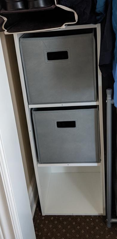 Shelf with fabric cubes.