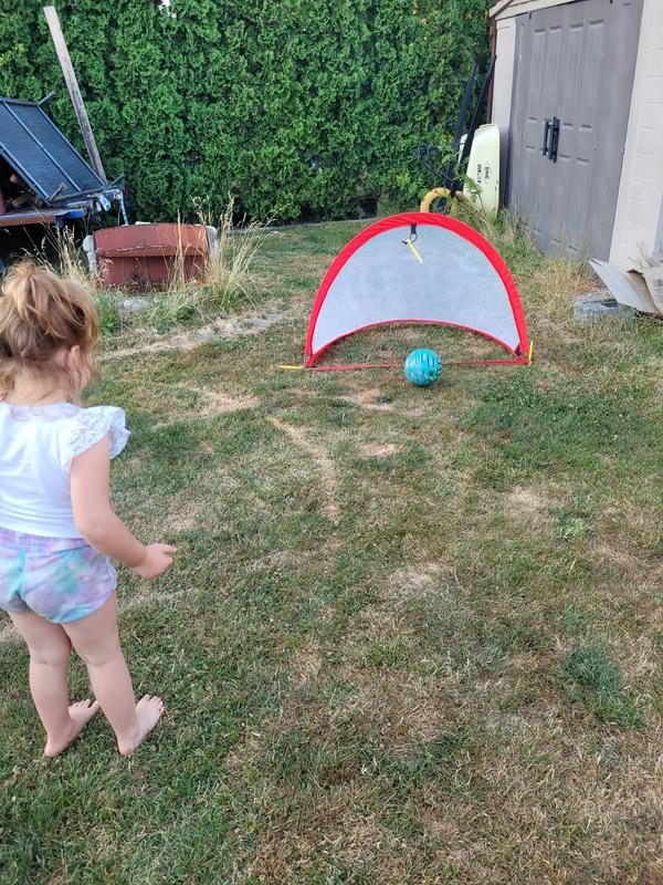 She loves to practice for soccer with her Lotto pop up Soccer net