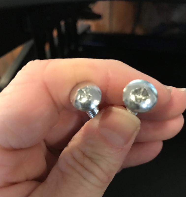 Round screw top after trying to put screw in the drywall plug.  Same thing happens when trying to put screw in the stud.
