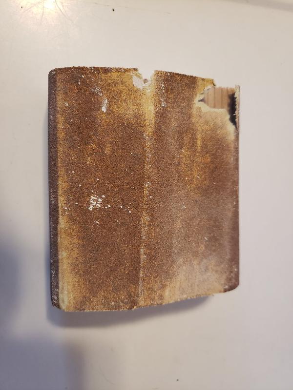 Garbage sandpaper after only a minute of use on drywall compound.