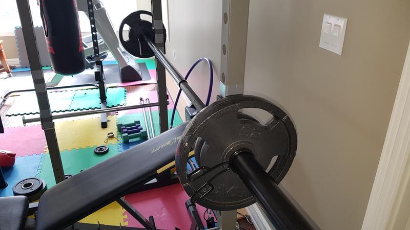 bar with full cage and guy bench