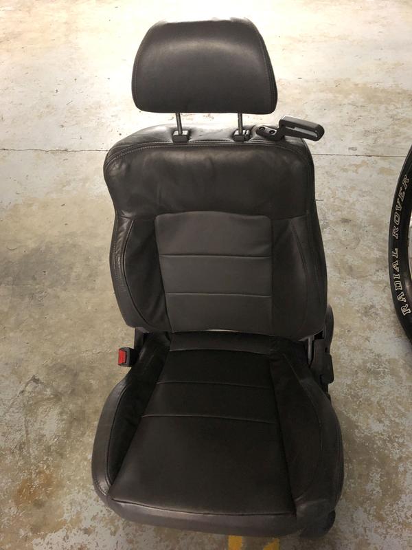 Driver side seat. (leather is actually lighter grey in color)