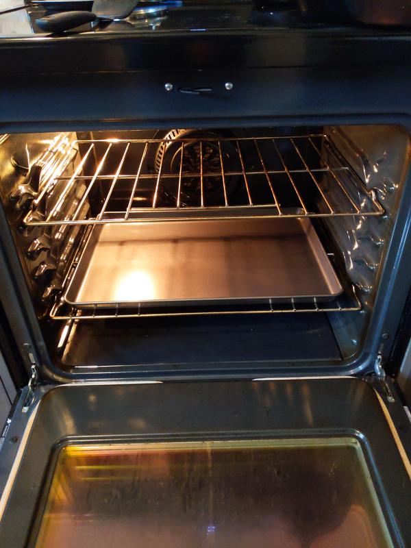 I would recommend a convection oven for this pan.