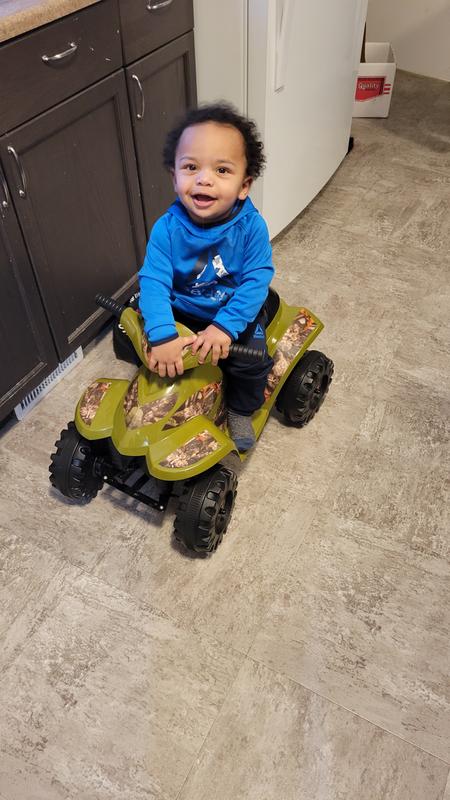 Baby boy loving his four wheeler