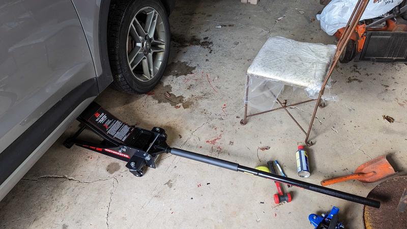 Heavy-duty, lever bar can be used to provide leverage to tire nut wrench.