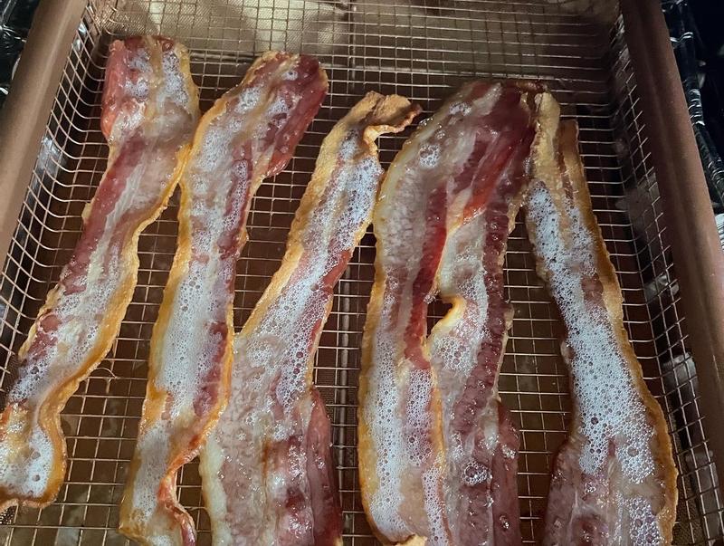 Bacon drained into container below onto non-stick mat, nothing stuck and clean up was easy in the end.