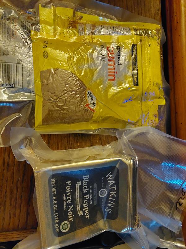 Ex.2- spices. Open up package to let air out, then vacuum. Watkins tin took a beating.