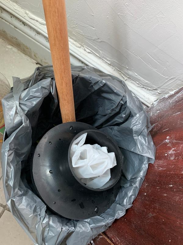 The white object inside the rubber part is the glove I used to remove it from the toilet after it broke off the handle