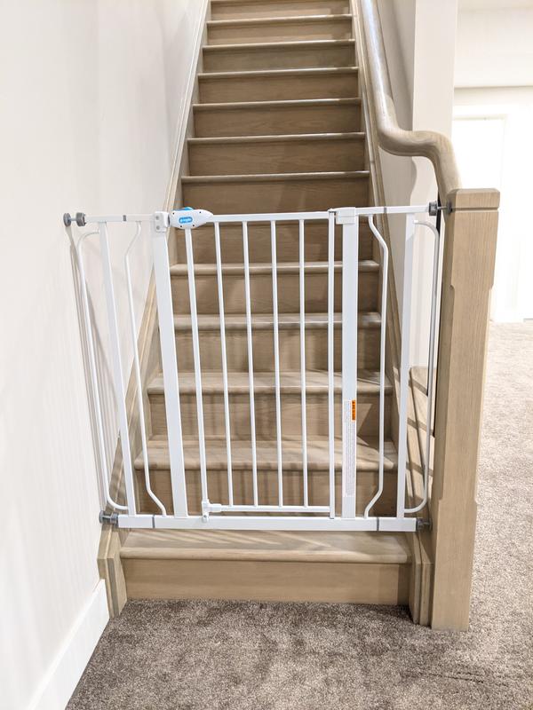 Installation at the bottom of stairs, using both side extensions. Door is set up to only swing out away from the stairs.