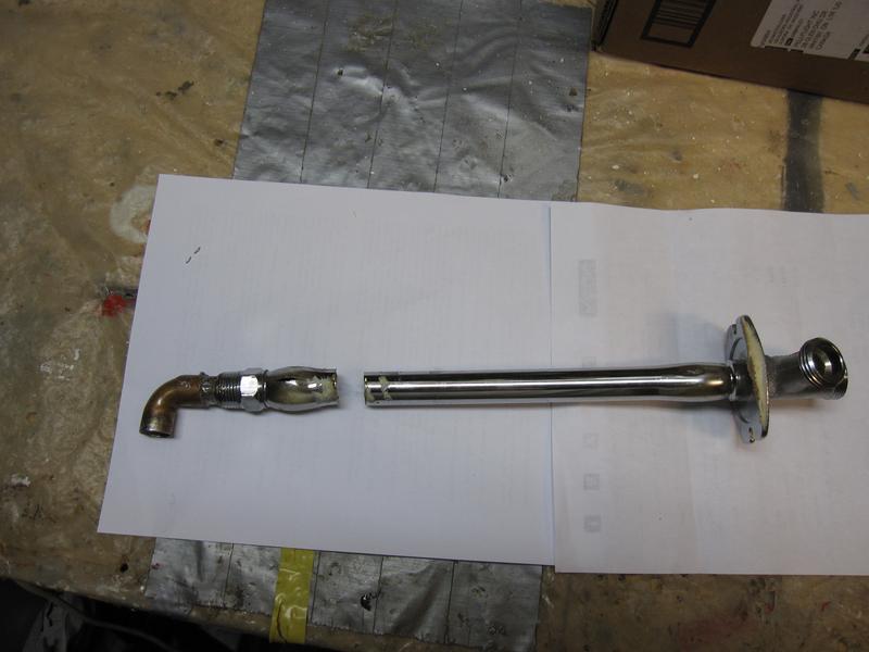 Hydrant valve bulged at both ends, and split on the left side near the pipe thread end.  The cut was made to remove the unit from the wall.