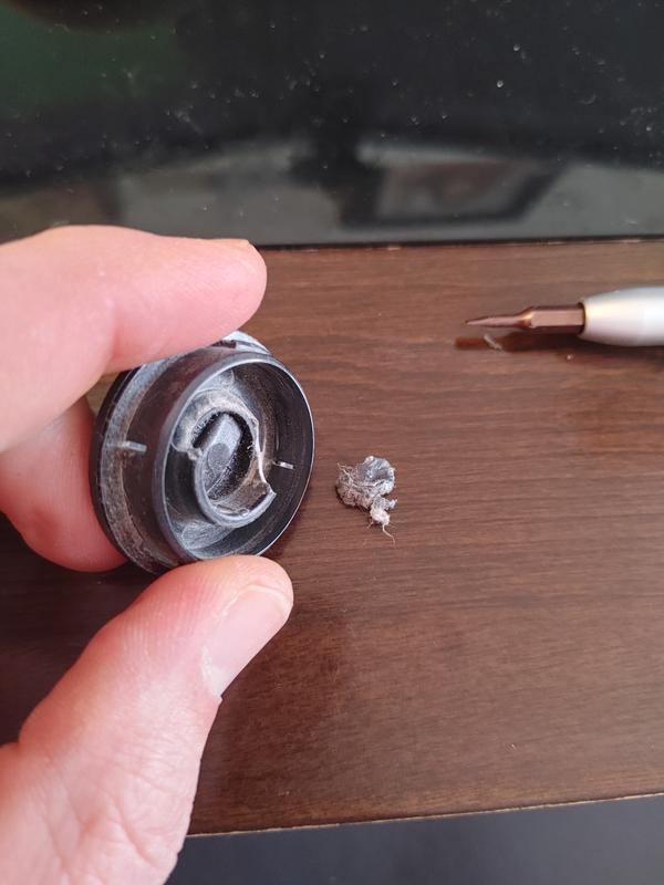 Beater Bar Removal cap, See the broken race where the bearing would sit, and the bit of plastic which used to be part of it.