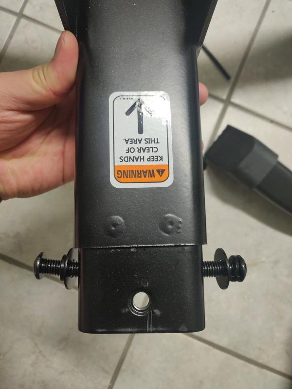 Not only is the weldnut welded on an angle, the whole section is off, you can see that one side of the welded component is longer than the other.