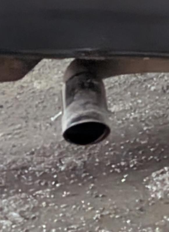 Tip in use. Notice the three mounting bolts- very visible if that's an issue for you or if your exhaust pipe isn't tucked away