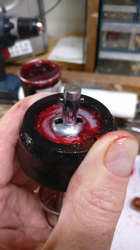 Rotate rod to engage or release from plunger.