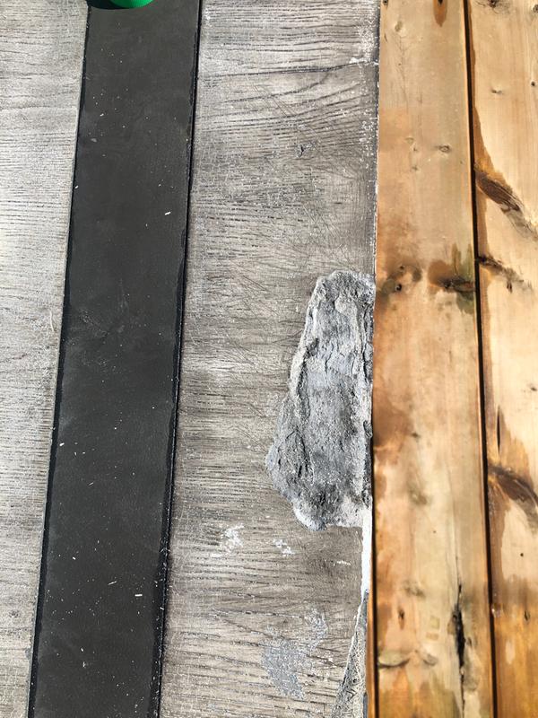 One of the crumbling sections on the table surface.