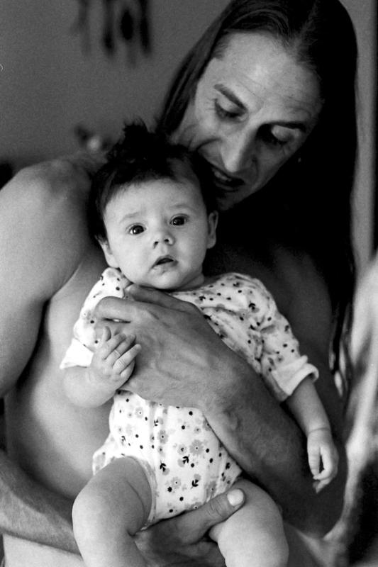 My son-in-law with my adorable granddaughter